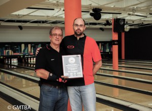 Steve Greven, GMTBA director, presents plaque to "Mr. Bowler" 2016-2017, Tim Thompson, who finished the season with a composite average of 233.84 earning him the title of Bowler of the Year for the Men